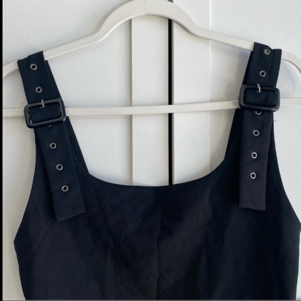 Black bodysuit with belted straps